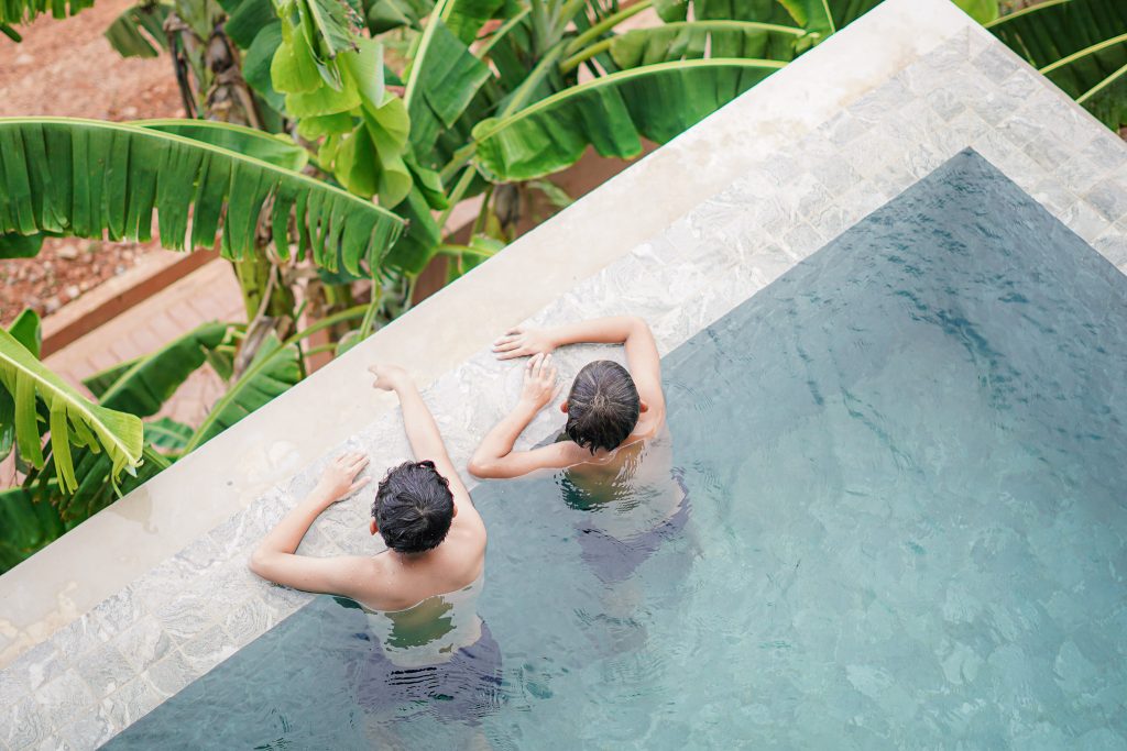 A top view of two children chilling in Amaya's pool. 