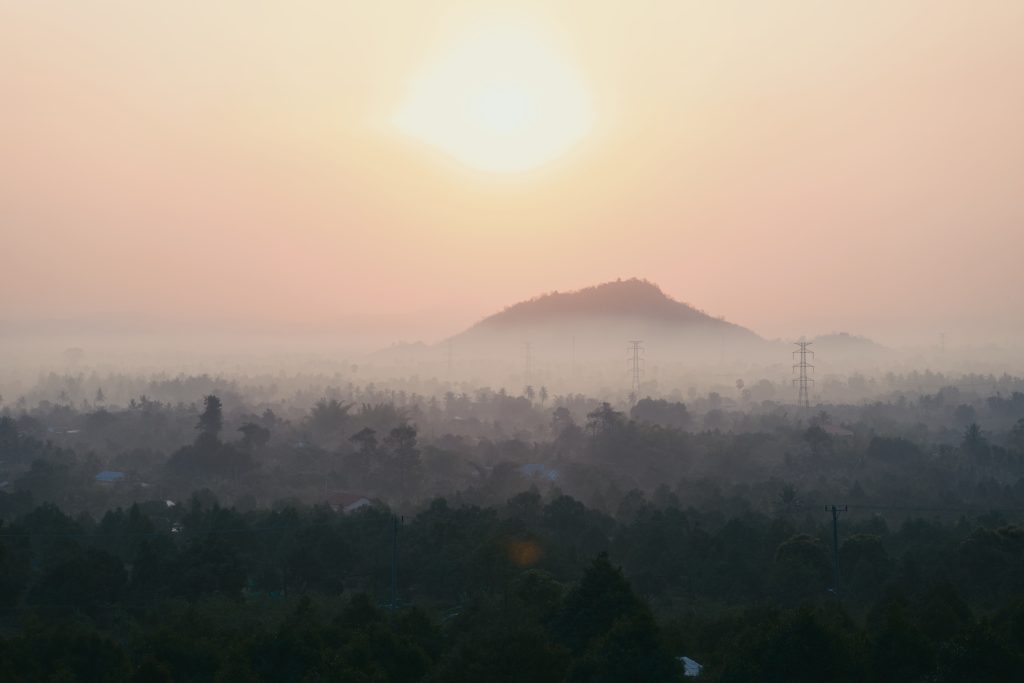 A view of the sunrise on top of a mountain taken from one of Amaya's homes